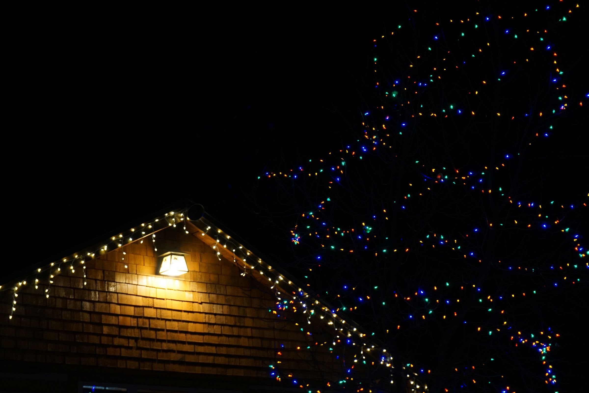 Illustrative photo of a home decorated with exterior Christmas lights.